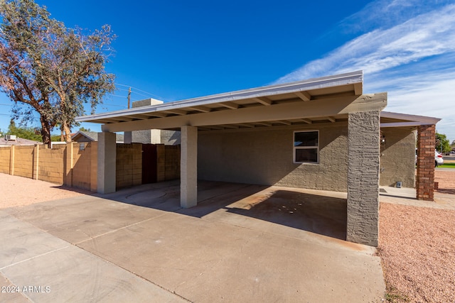 rear view of house featuring a carport