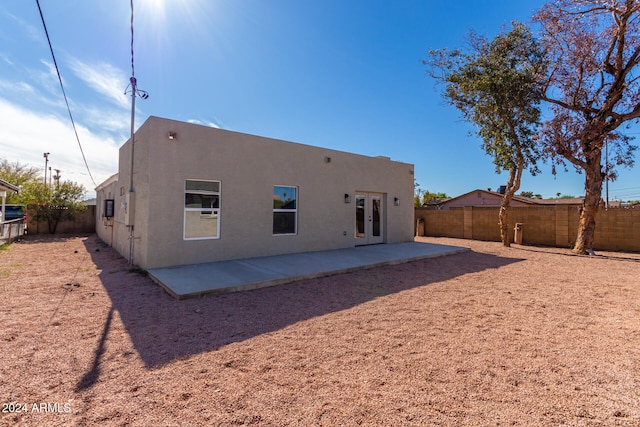 rear view of house with a patio and french doors