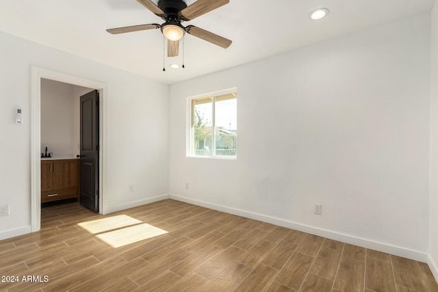 unfurnished room with ceiling fan and light hardwood / wood-style floors