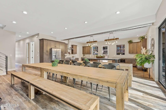 301 S O Leary St, Flagstaff, AZ 86001 - dining room featuring light wood-type flooring, recessed lighting, baseboards, and stairs