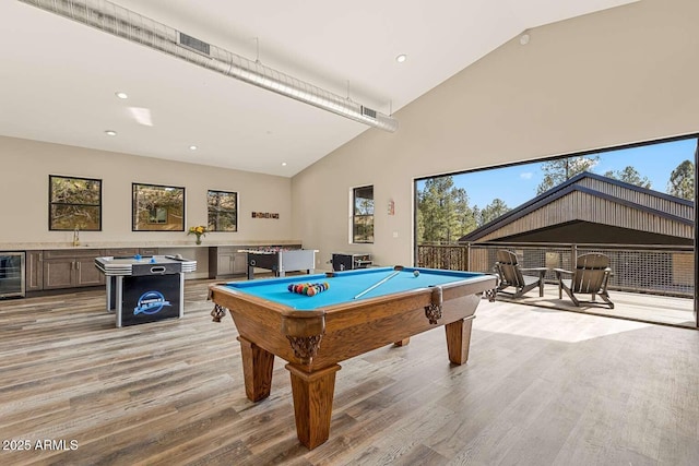 301 S O Leary St, Flagstaff, AZ 86001 - recreation room featuring plenty of natural light, high vaulted ceiling, wine cooler, and light wood-type flooring