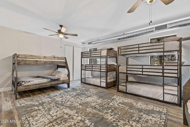 301 S O Leary St, Flagstaff, AZ 86001 - bedroom featuring wood finished floors, visible vents, and baseboards