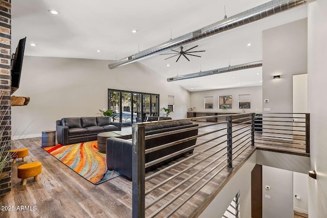 301 S O Leary St, Flagstaff, AZ 86001 - living room with ceiling fan, recessed lighting, wood finished floors, a towering ceiling, and baseboards