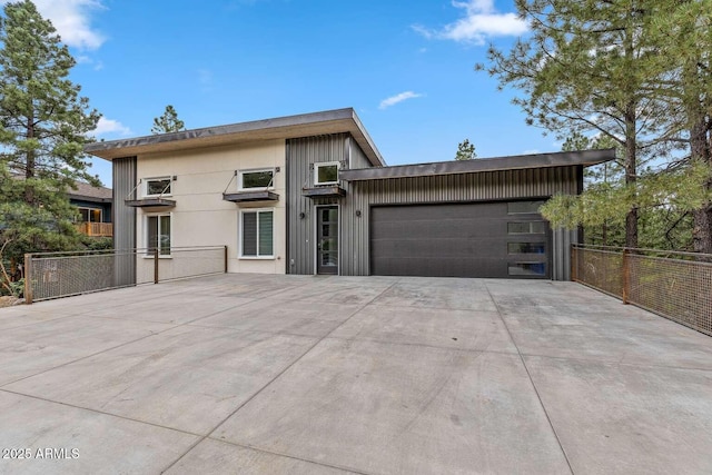 301 S O Leary St, Flagstaff, AZ 86001 - view of front of property featuring an attached garage, fence, and concrete driveway