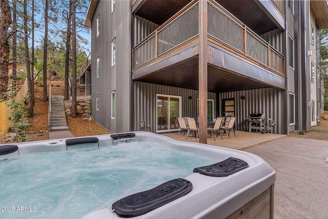 301 S O Leary St, Flagstaff, AZ 86001 - back of property featuring a balcony, a hot tub, and a patio