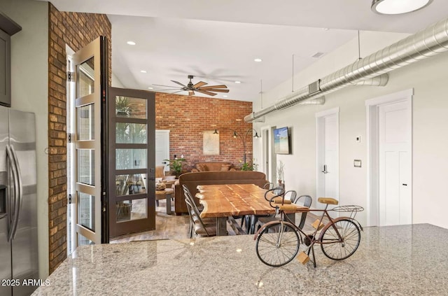 301 S O Leary St, Flagstaff, AZ 86001 - dining room featuring a ceiling fan, recessed lighting, and brick wall