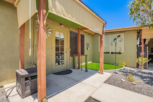 863 W 14th Ave, Apache Junction, AZ 85120 - doorway to property featuring a patio