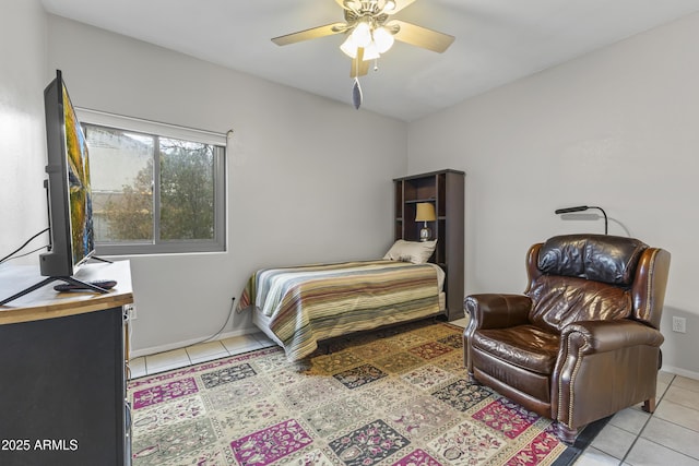 tiled bedroom featuring ceiling fan