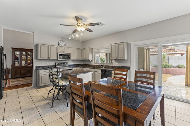 kitchen featuring gray cabinets, light tile patterned flooring, sink, ceiling fan, and black appliances