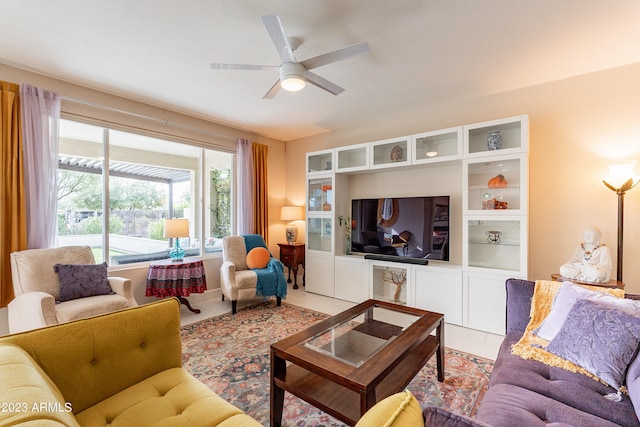 tiled living room featuring ceiling fan