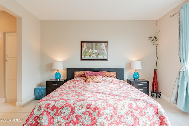 bedroom with light tile patterned flooring