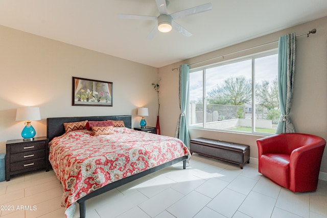 tiled bedroom featuring ceiling fan