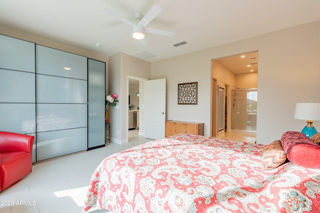 bedroom with ensuite bath and ceiling fan