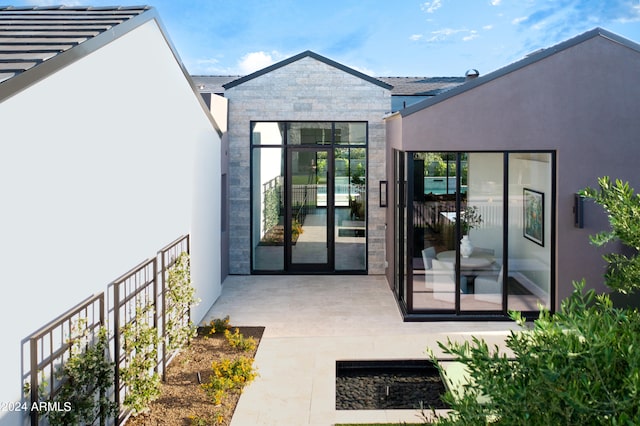 property entrance with a patio area