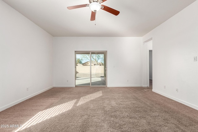 empty room with ceiling fan and carpet flooring