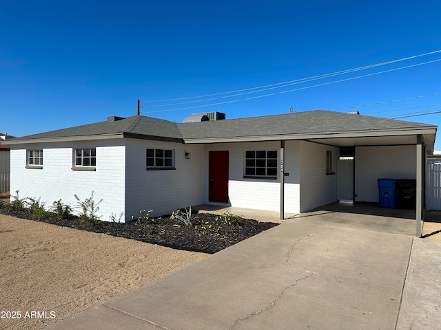 ranch-style house with a carport