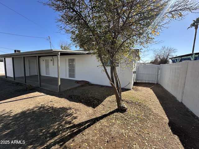 back of property with a patio area