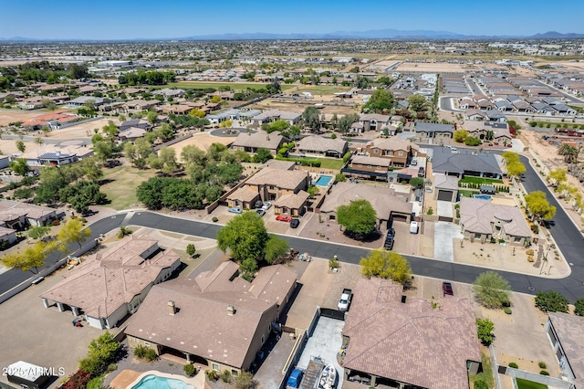 birds eye view of property featuring a mountain view and a residential view