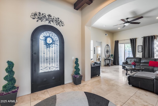 entrance foyer with recessed lighting, arched walkways, ceiling fan, and light tile patterned floors