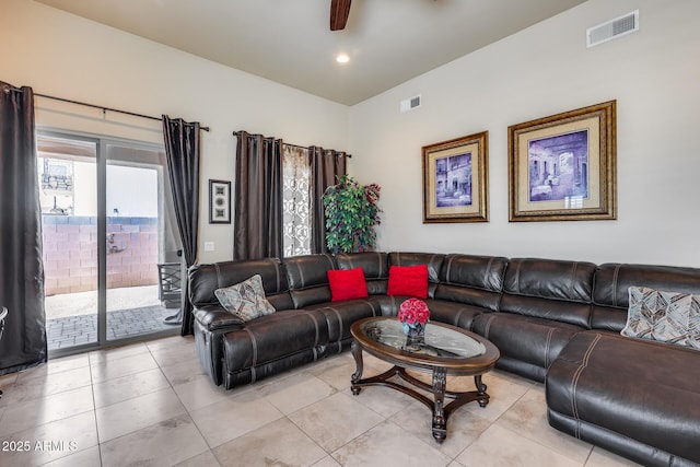living room featuring visible vents and light tile patterned floors