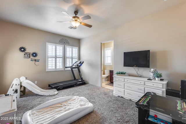 exercise area with ceiling fan, carpet, and visible vents
