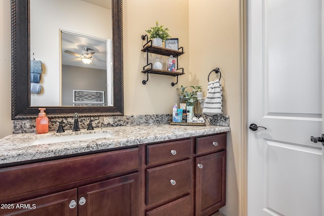 bathroom featuring a ceiling fan and vanity