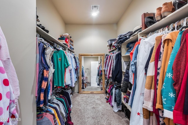 spacious closet featuring carpet flooring and visible vents