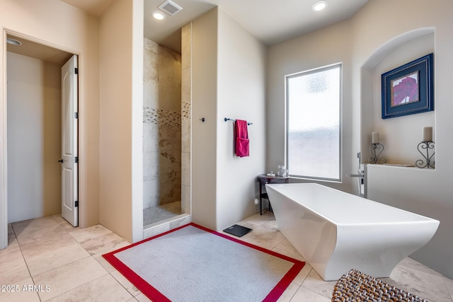 bathroom with visible vents, tile patterned floors, a soaking tub, recessed lighting, and tiled shower