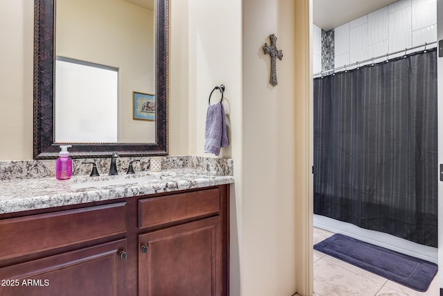 bathroom featuring vanity, a shower with shower curtain, and tile patterned floors