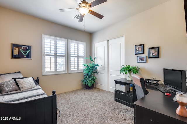 bedroom with a closet, carpet, ceiling fan, and visible vents