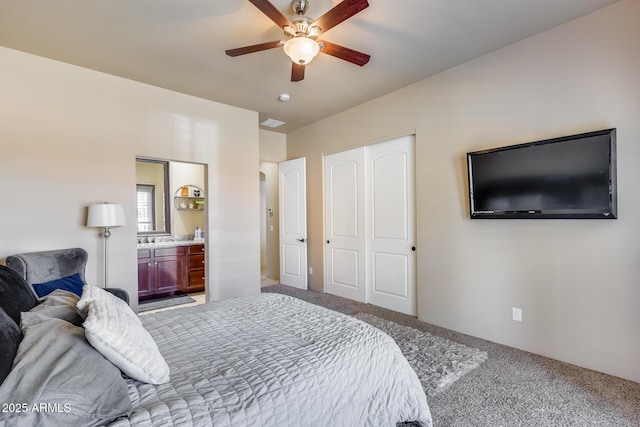 bedroom featuring a closet, visible vents, ceiling fan, connected bathroom, and carpet flooring