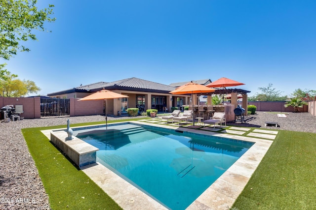 view of swimming pool featuring a patio, a fenced backyard, outdoor dry bar, a gazebo, and a hot tub
