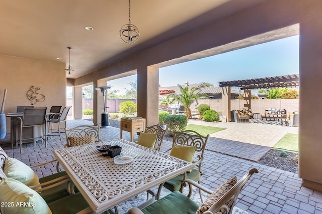 view of patio / terrace featuring a pergola, outdoor dining area, and a fenced backyard