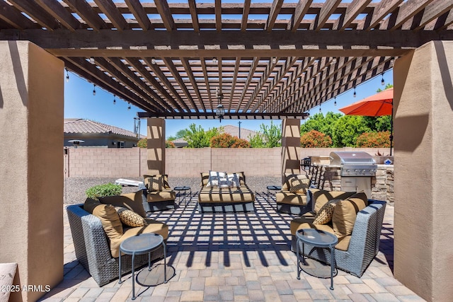 view of patio / terrace with a fenced backyard, an outdoor kitchen, outdoor lounge area, a pergola, and a grill