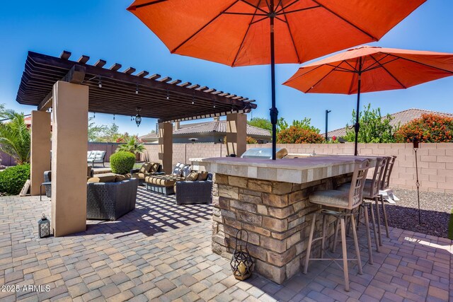 view of patio / terrace featuring a fenced backyard, outdoor dry bar, a pergola, and outdoor lounge area