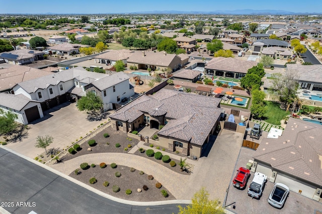 birds eye view of property with a residential view
