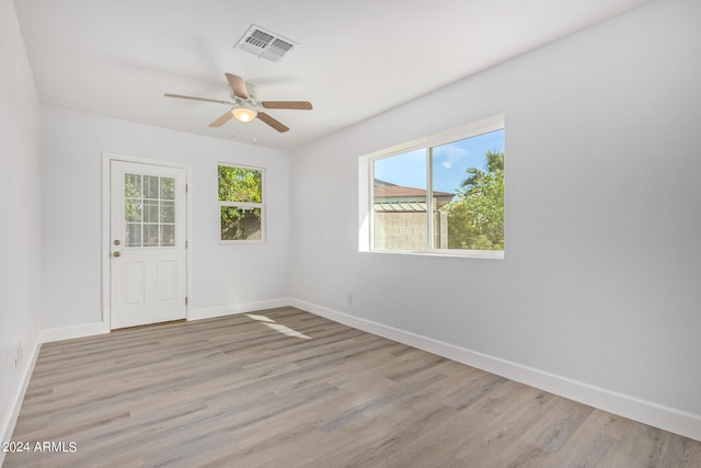 unfurnished room with light hardwood / wood-style floors and ceiling fan