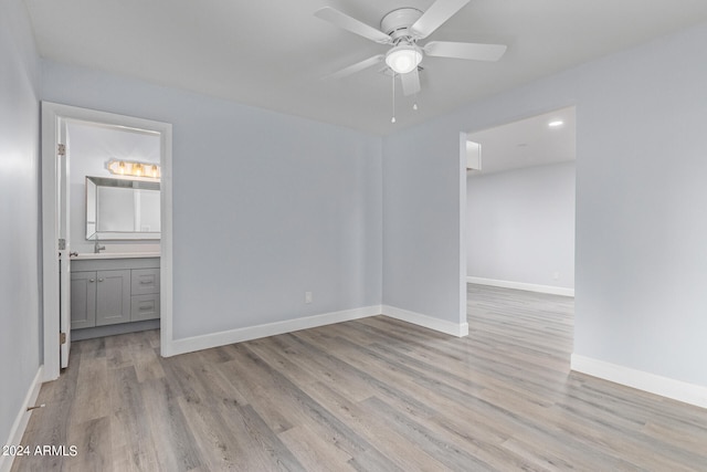 spare room with light hardwood / wood-style floors and ceiling fan