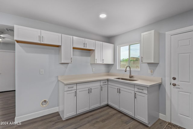 kitchen featuring sink, ceiling fan, dark hardwood / wood-style flooring, and white cabinetry