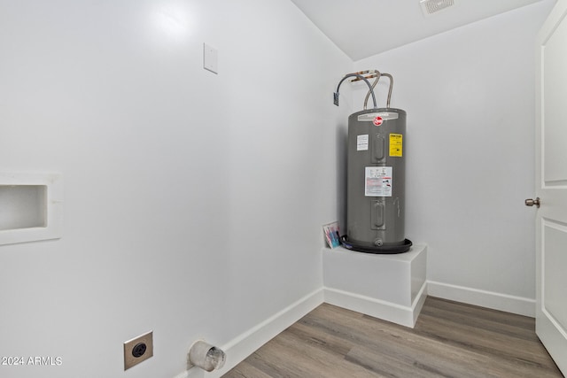 utility room featuring water heater