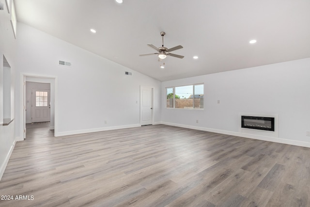 unfurnished living room with high vaulted ceiling, light hardwood / wood-style floors, and ceiling fan