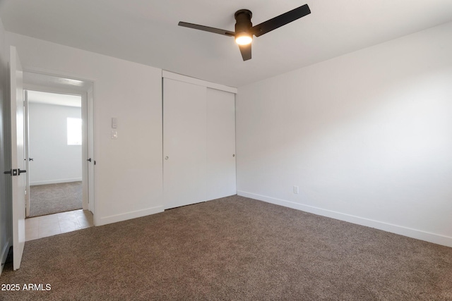 1205 W 7th St, Tempe, AZ 85281 - unfurnished bedroom featuring carpet floors, a closet, baseboards, and a ceiling fan
