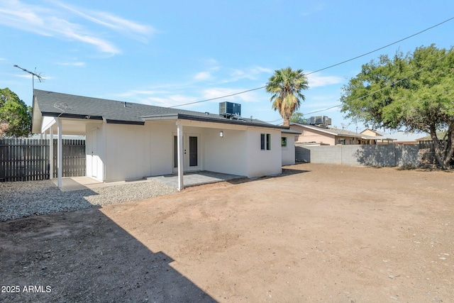1205 W 7th St, Tempe, AZ 85281 - rear view of house with central AC unit, a patio area, and roof with shingles