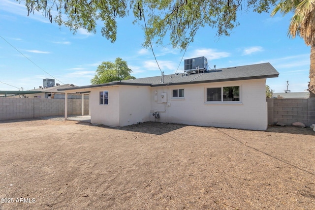 1205 W 7th St, Tempe, AZ 85281 - rear view of property with central AC, a fenced backyard, and brick siding
