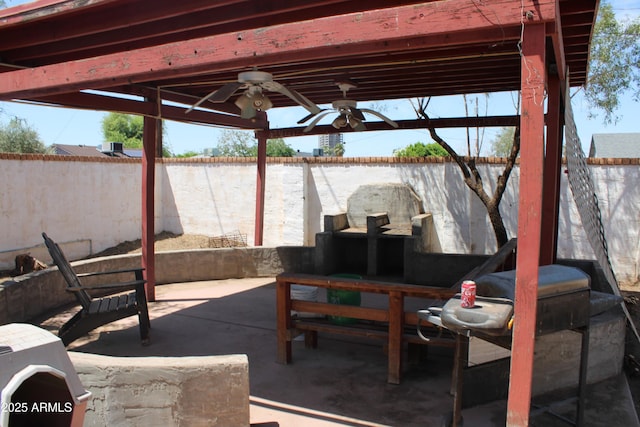 view of patio with a fenced backyard and ceiling fan
