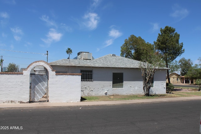 view of front facade with a gate and fence