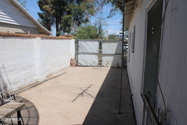 view of patio / terrace with a gate