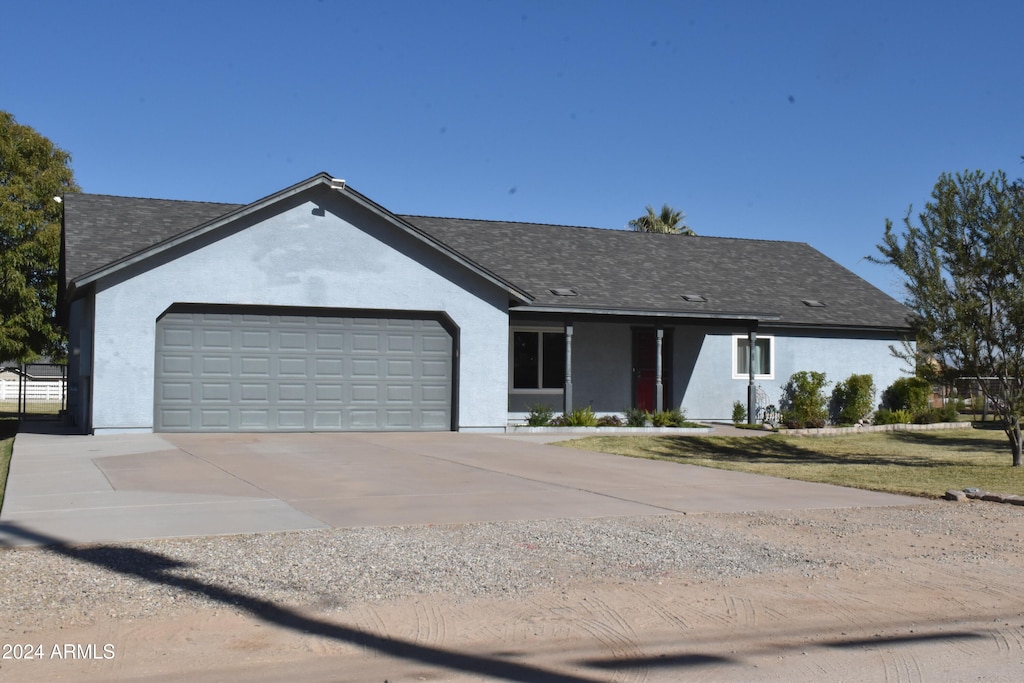 single story home featuring a garage