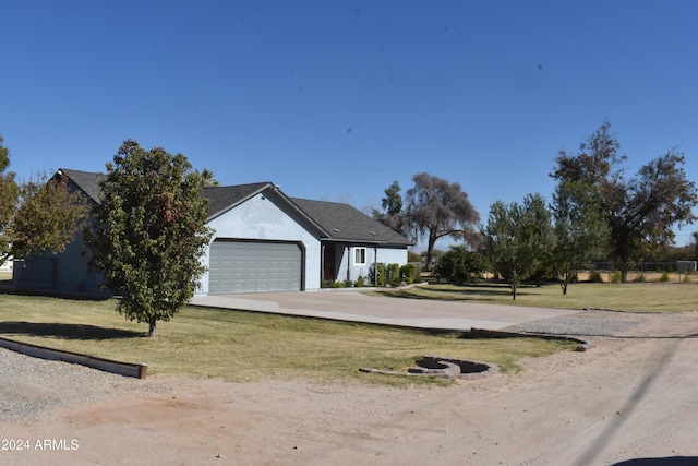 view of front facade featuring a garage and a front lawn