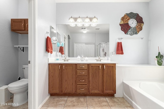 full bathroom featuring tile patterned floors, vanity, shower with separate bathtub, and toilet